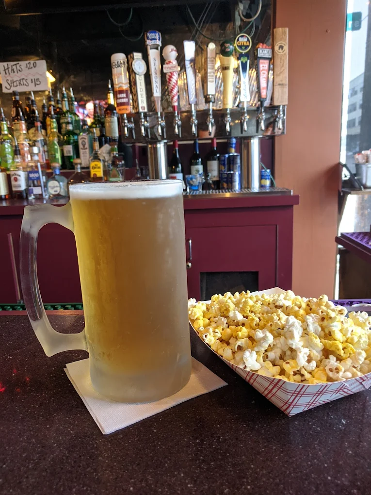 Frosted mug of beer with free popcorn at Duke's bar